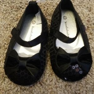 Black sequenced baby shoes